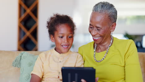 grandmother, child and laugh with tablet on sofa