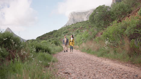 Walking,-hiking-and-couple-on-path-on-mountain