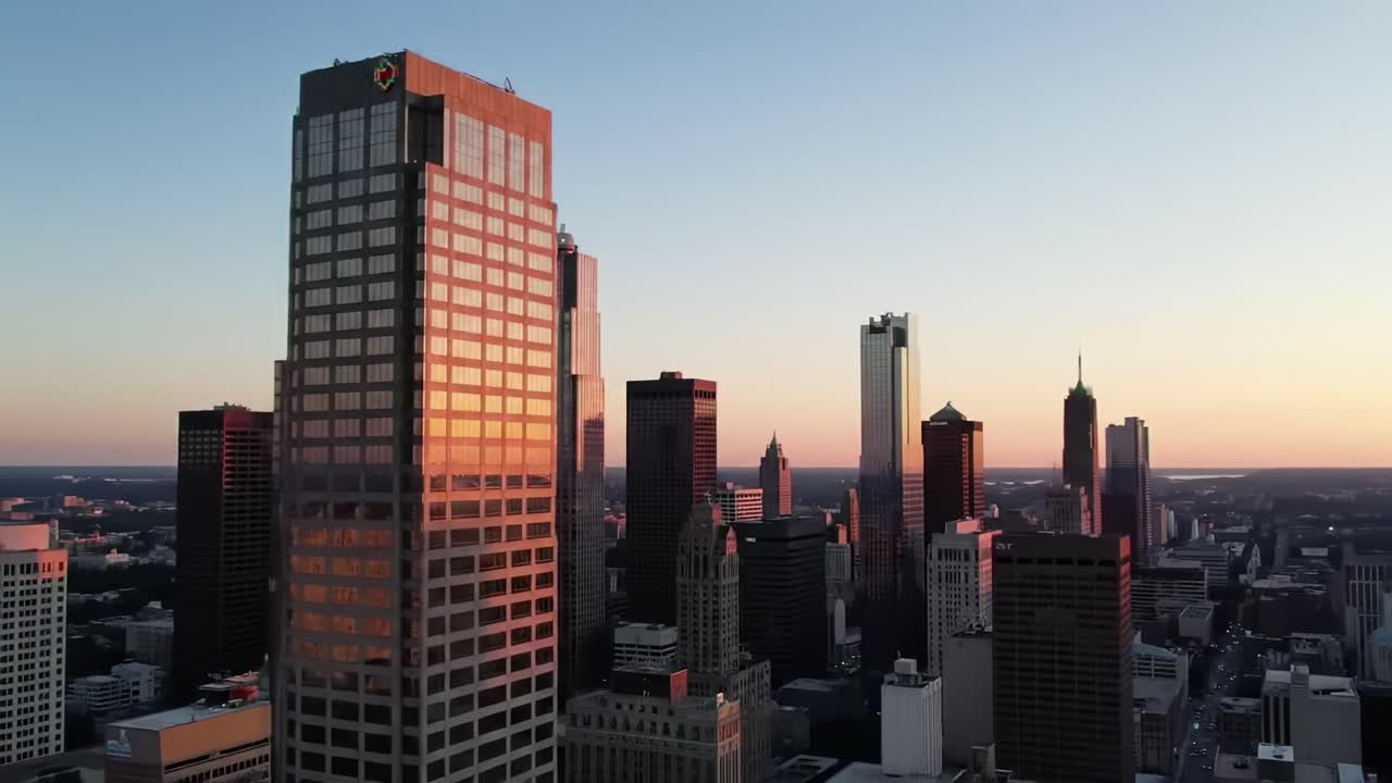 Stunning Sunset Over Urban Skyline, Capturing the Last Light Glimmering on Skyscrapers, Signaling the End of Another Day in the Heart of the City