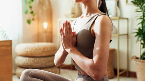 woman practicing yoga meditation at home