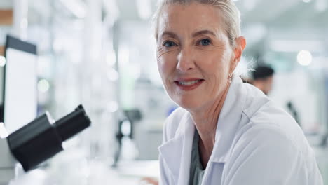 portrait of a smiling female scientist in a laboratory