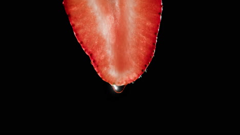 close-up of a strawberry slice with water droplet
