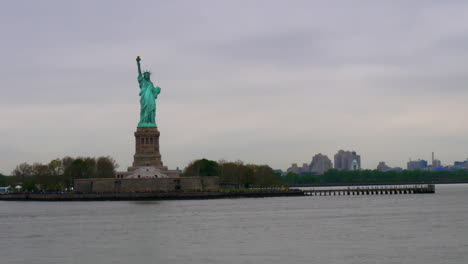 a shot of the statue of liberty from the ellis island ferry at new york city