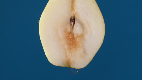 Detail-of-pear-slice-with-water-falling-on-the-piece-in-slow-motion