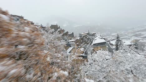 FPV-aerial-flying-over-a-snowy-winter-landscape-in-the-Pyrenees-mountains-of-Andorra