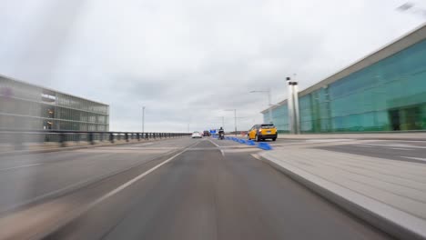 airport of barcelona driving a car on the barcelona motorway highway in spain, fast camera mounted on the front