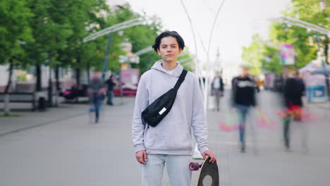 Teenager with Skateboard in City