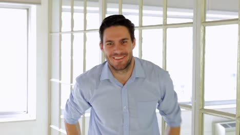 cheerful businessman showing thumbs up