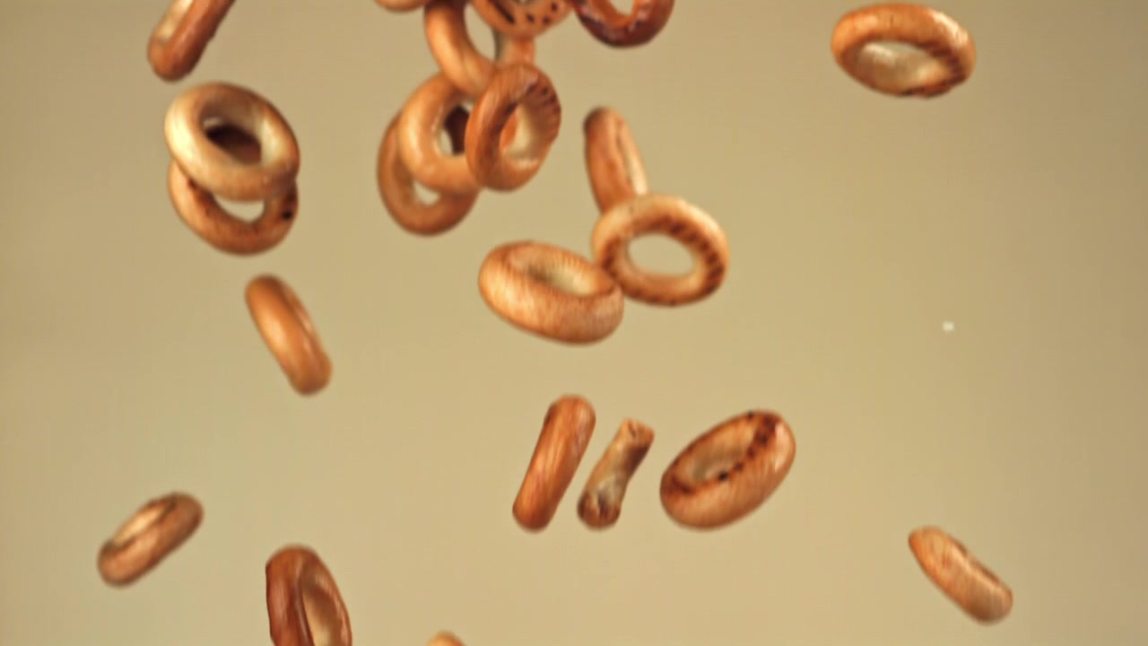 Golden Brown Baked Goods Falling in Slow Motion