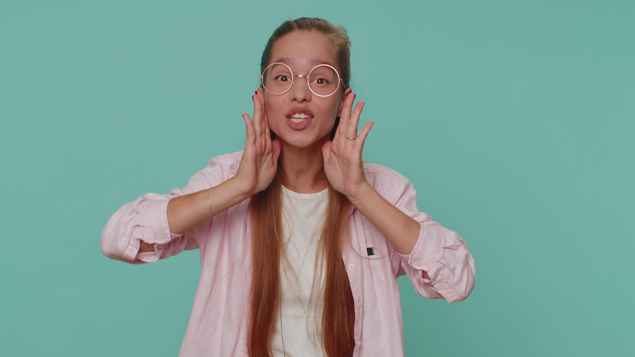 Girl holding hands near mouth loudly screaming, shouting, yelling, announces discounts sale, hello