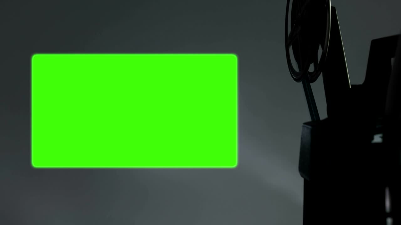 proyector de películas viejas con relación de aspecto 16 x 9 clave de croma fondo de pantalla verde y efecto parpadeo, estilo vintage