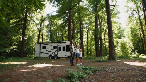 family camping adventure with rv in a lush forest