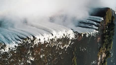 vertical aerial view victoria falls, shungu namutitima at the border of zimbabwe and zambia in africa