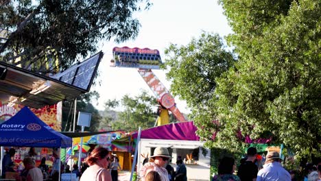 people enjoying a sunny day at a festival