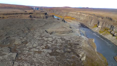 aerial establishing shot of the beautiful jokulsargljufur canyon running through iceland