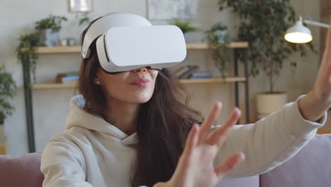 young woman experiencing augmented reality with vr glasses