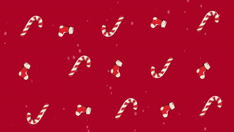 Multiple-Christmas-stockings-and-candy-canes-moving-against-red-background