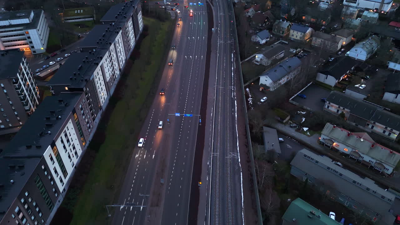 High angle drone shot over traffic on the Helsingin valtatie road, dusk in Turku
