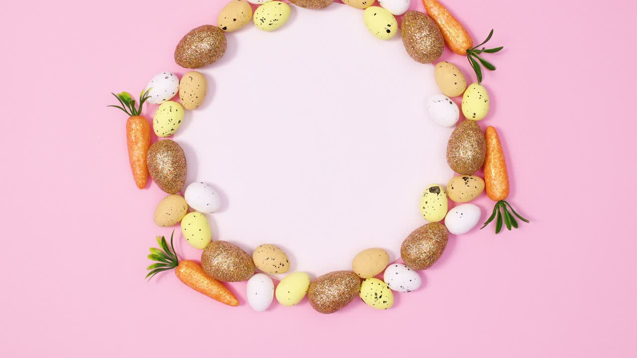 Round paper card note surrounded by Easter eggs and carrots. Stop motion