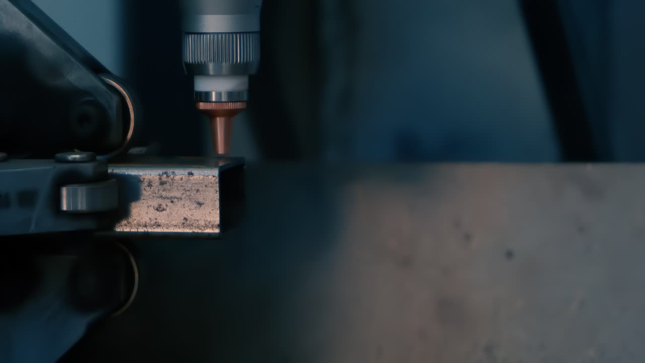CNC Laser cutting of metal, modern industrial technology Making Industrial Details. Shot on super slow motion camera 1000 fps