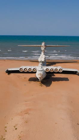 abandoned giant seaplane on a beach