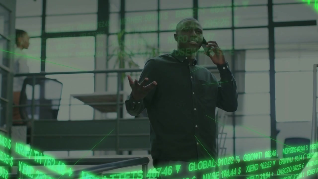 Man speaking on phone on stair, moving to gestures while green market ticker sweeping, hiding hands
