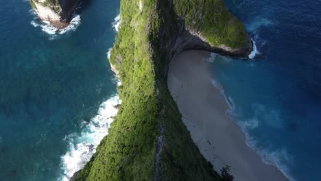 aerial view of mountain path on top of cliffs beside kelingking beach