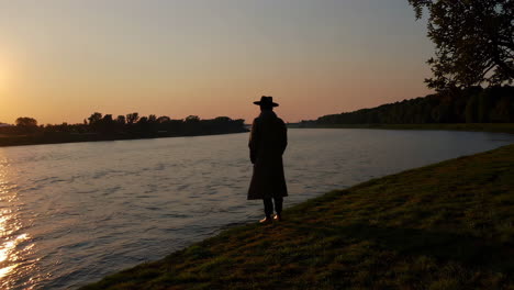 man at sunset by the river