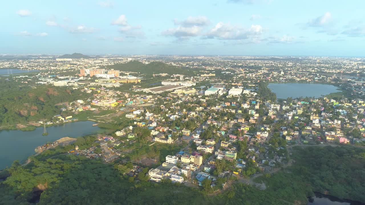 Drone shot with movement forwards showing a city in birds eye view