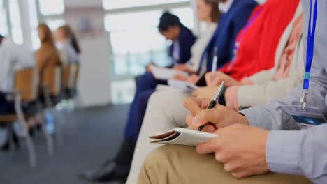 business people writing on notepad in the business seminar 4k