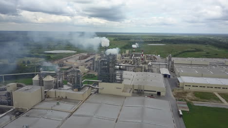 Aerial-view-of-industrial-facility-with-smoking-pipes