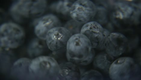 higher contrast version, macro close up blueberries spinning in water, perfect shot for refreshing drink commercials or cooking ingredient introduction
