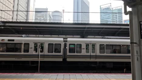 train moving across urban landscape backdrop