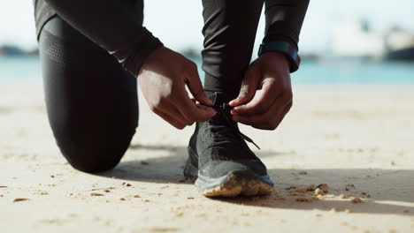 Hands,-shoes-and-tie-with-a-man-on-the-beach