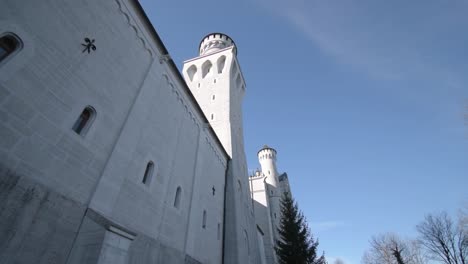 Outside-facade-of-the-Neuschwanstein-castle-under-a-blue-sky