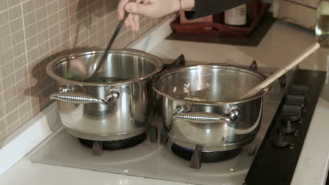 chef pours broth, italian recipe