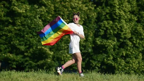 woman celebrating pride in a park