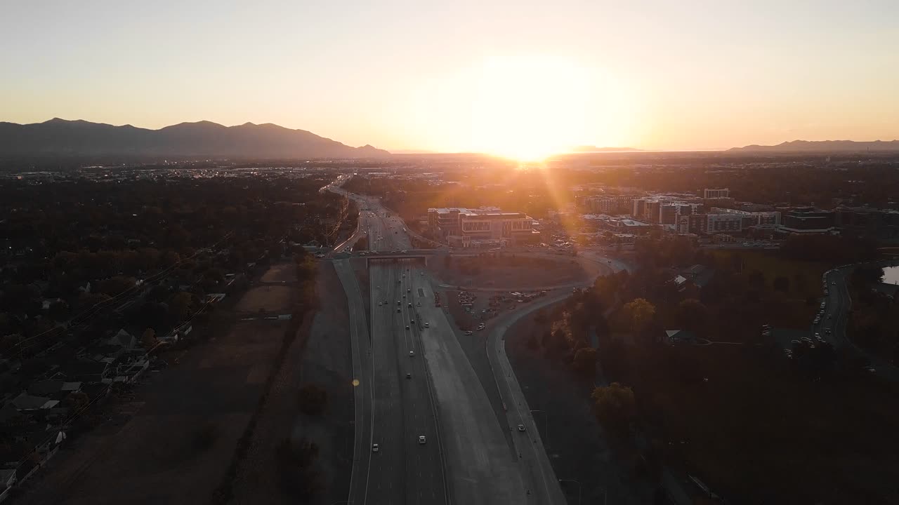 Aerial Drone Flight Over Highway at Sunset