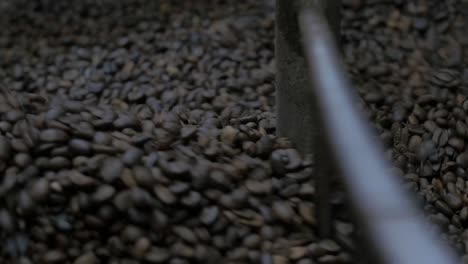 coffee-roaster-spinning-beans-fast,-close-up-shot-at-Nicaraguan-coffee-roaster