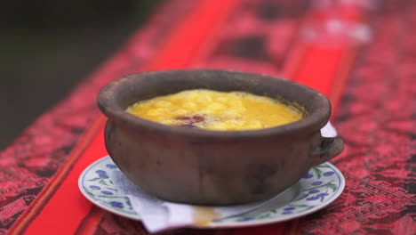 close up of hot boiling humita argentine peasant dish served in a casserole