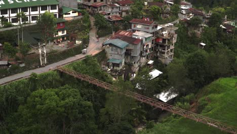 a winding road through a village in the philippines