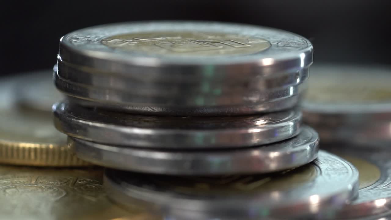 Close-up of stacked coins, symbolizing wealth and economy