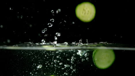 courgette slices falling in water