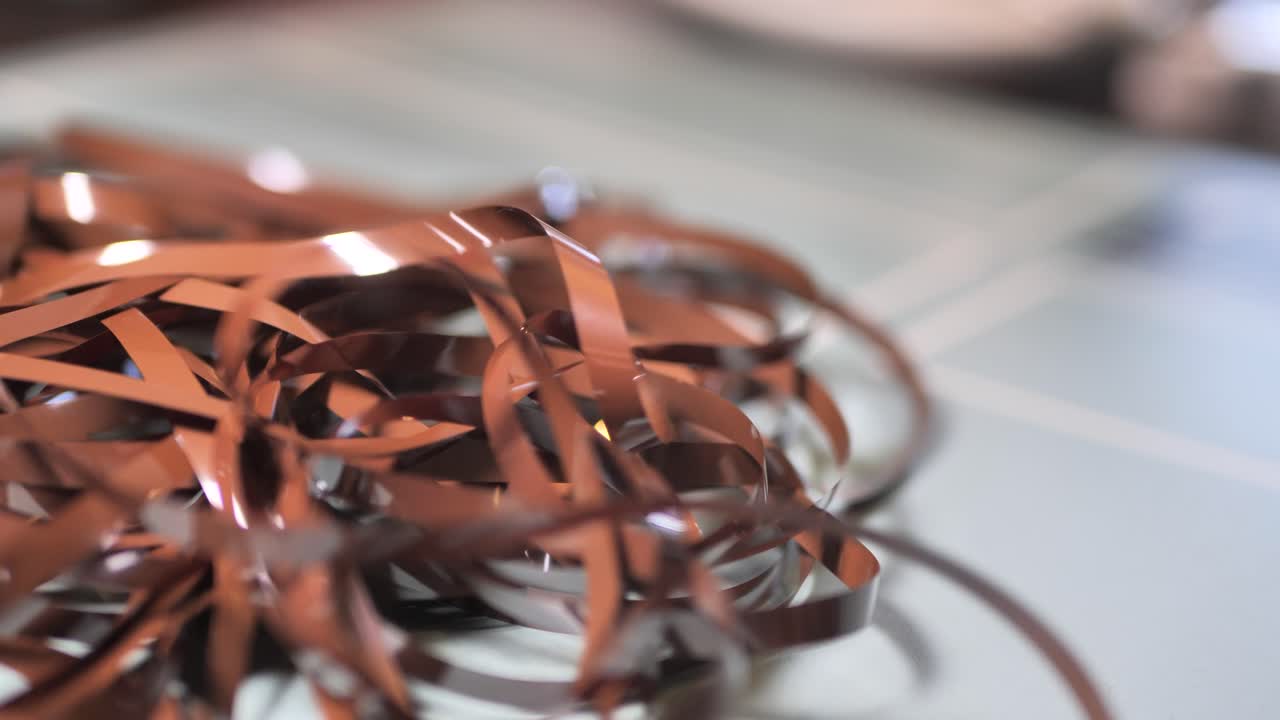 Tape Unreel. Pulling the tape out. Destroying cassette tape media. Slide A