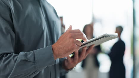 man using tablet in business setting