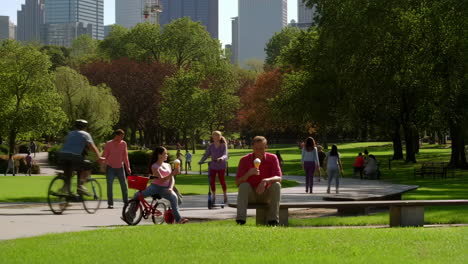People enjoying various activities in a sunny city park
