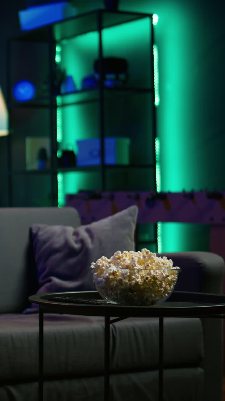 Vertical video Close up of snack prepared for movie night in home theatre