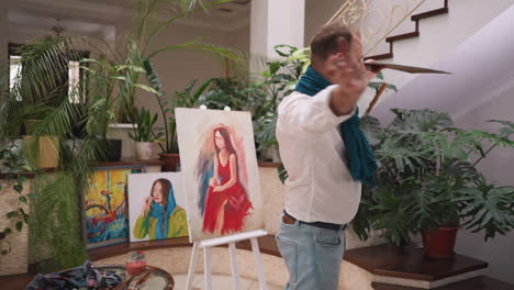 artist painting a portrait in his studio