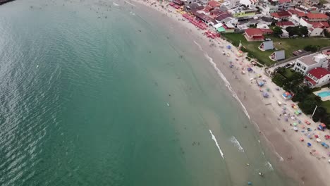 drone footage of a beach called barra da lagoa in florianópolis, brazil.