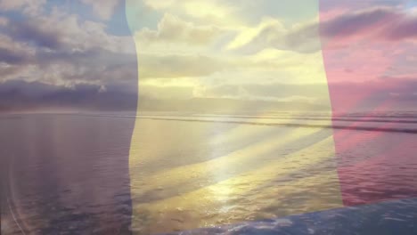 Digital-composition-of-belgium-flag-waving-against-aerial-view-of-waves-in-the-sea